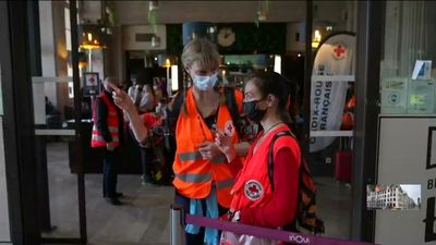 Russian volunteers help welcome Ukrainian refugees at Paris's Gare de l'Est