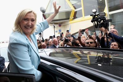 Factbox-Far-right Le Pen cloaks nationalist policies with social veneer