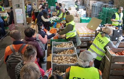Ukrainian refugees queue for food in wealthy Switzerland