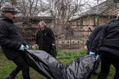 AP PHOTOS: The artist retrieving bodies in Ukraine's Bucha