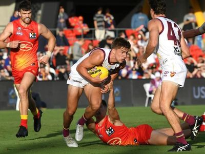 Bailey lifts Lions to AFL win over Suns