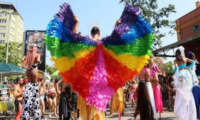 ‘Carnival is politics’: revellers bring anti-Bolsonaro sentiment to Rio’s streets