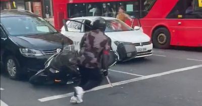 Thugs wielding machetes chase man outside tube station in front of horrified commuters