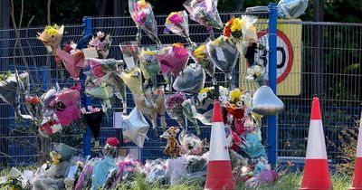 Dozens of bouquets left at scene of double-fatal crash