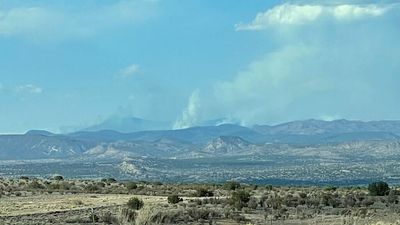 1 dead as fires force thousands to flee as "dangerously early" season hits several U.S. states