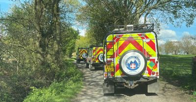 Woman rushed to hospital after being rescued near to woodland