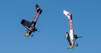 Air stunt goes badly wrong as Red Bull pilots try to SWAP planes 12,000ft up