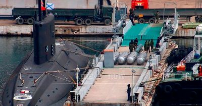 Russian nuclear-capable missiles seen being loaded onto submarine in chilling images