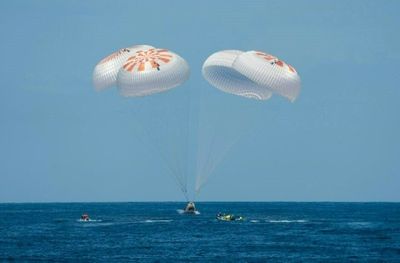 Crew of first private flight to ISS return to Earth