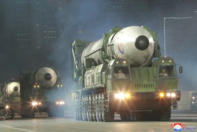 N.Korea's Kim vows to boost nuclear arsenal as parade shows ICBMs