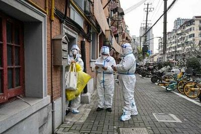 Covid camps, fenced-off apartments and workers forced to sleep in factories — inside Shanghai’s lockdown