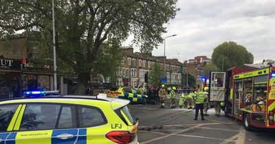 Massive crash 'involving Met Police car' shuts busy London street