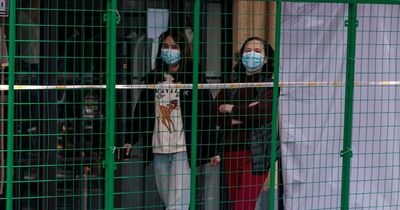 Chinese police build CAGES around homes in world's strictest Covid lockdown
