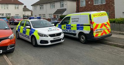 Three men hunted after gunman bursts into woman's home and shoots her