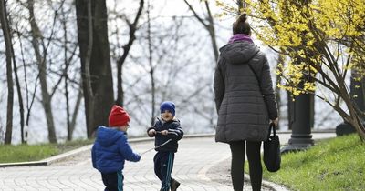Ukrainian kids play in Kyiv parks in spring sun in rare glimpse of return to normality