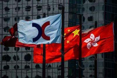 Hong Kong exchange profits plunge amid IPO drought, virus woes