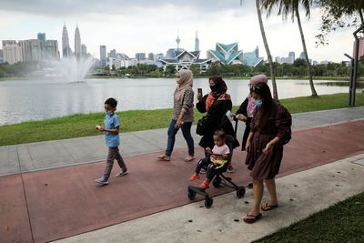 Malaysia to lift more COVID curbs, eases mask mandate