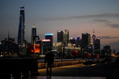 Financial lobby group urges Shanghai to ease COVID rules for staff stuck in offices