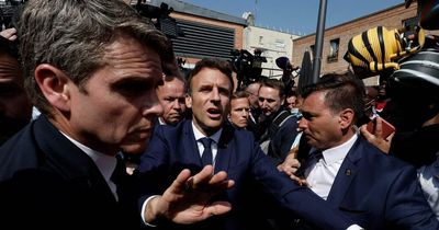 French President Emmanuel Macron pelted with tomatoes during surprise Paris visit