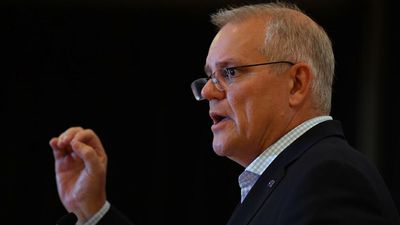 PM defends management as rate rise lurks
