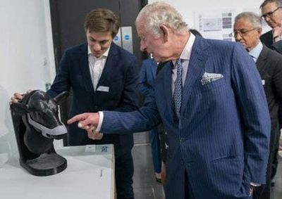 Prince Charles intrigued by a new face mask for burping cows to cut methane emissions