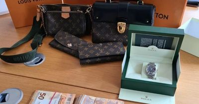 Criminal Assets Bureau seizes cash, Rolex watch, designer goods and more after search operation in Meath