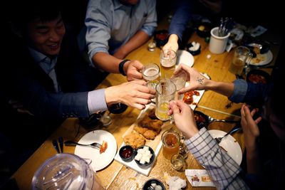 Young S.Koreans dread revival of work dinners as pandemic eases