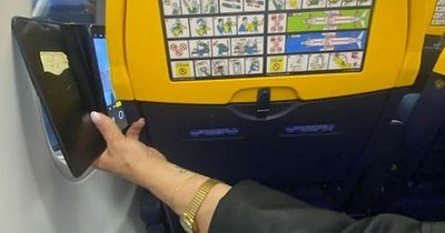 Edinburgh Ryanair passenger fumes as woman leans over them to take video