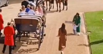 Queen's great-grandchildren spotted playing in carriages while royals watch on