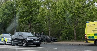 Audi FLIPS onto its roof after two-car smash near Old Trafford