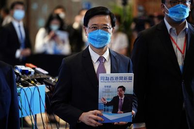 Hong Kong's leadership candidate pledges to save city's competitiveness