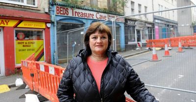 Dumfries businesses hit out at road closure after derelict building starts to crumble
