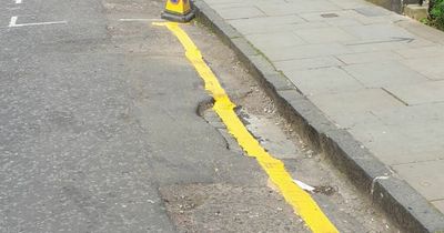 Edinburgh council mocked for painting yellow road marking over a pothole