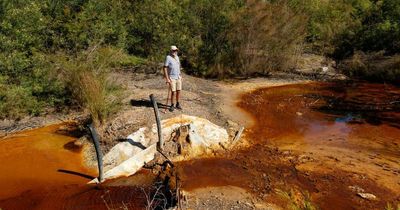 Red and dead: Streams of acid leach from old Hunter mines
