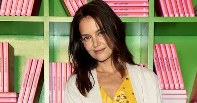 Katie Holmes goes public with romance with musician to the stars as they kiss in park