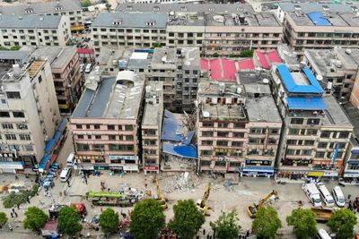 At least 20 trapped in China building collapse