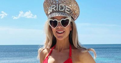 Kate Lawler living it up in pink bikini and bride-to-be hat on hen weekend in Mallorca