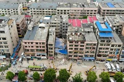 Five rescued and dozens missing in China building collapse