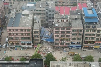 Police arrest 9 after building collapses in central China
