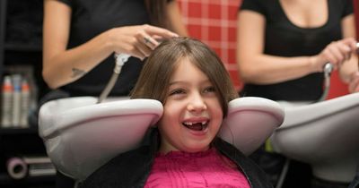 Dad takes daughter, 8, to get her long hair shaved off behind mum's back