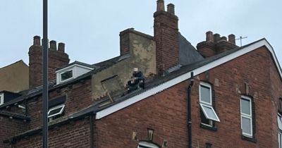 Leeds police standoff latest as wanted man still on roof and street shut down