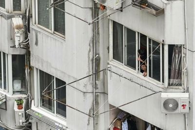 Taiwan will not 'cruelly' lock down like China: premier