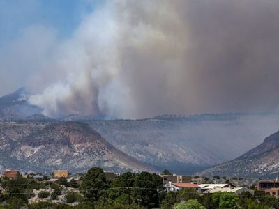 Firefighters battling the nation's largest active wildfire brace for strong winds