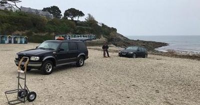 Tourists get BMW stuck all night on West Country beach because they did not want to carry kayak