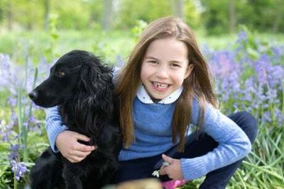 Princess Charlotte pictured in seventh heaven with pet dog Orla on birthday