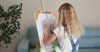 Dad takes young daughter to get curly waist-length blonde hair shaved off behind mum's back
