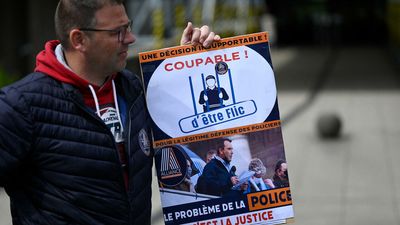 French police rally against arrest of officer who shot dead two men