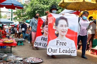 Myanmar's Suu Kyi charged with bribery as new trial opens