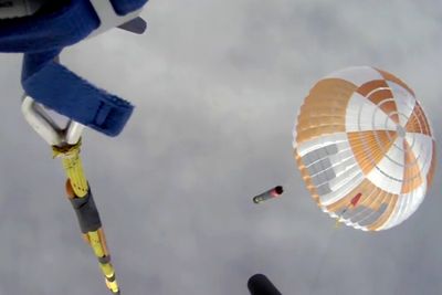 Rocket Lab helicopter catches rocket booster, then drops it