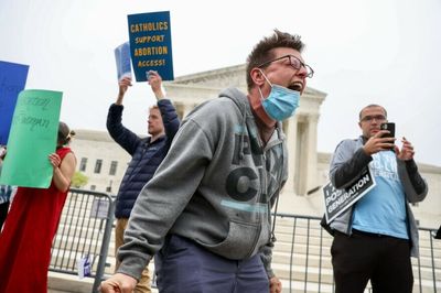 Demonstrators gather at the Supreme Court's doorstep following Roe v Wade opinion leak